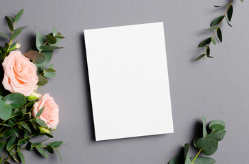 Blank invitation card mockup with fresh roses flowers, greeting card with copy space