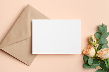 Blank invitation card mockup with fresh roses flowers, greeting card with copy space