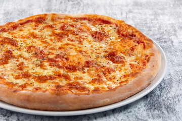 fresh pizza on the white plate