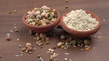 Mixed dry organic cereal and grain seed pile on wooden background. For healthy food ingredient or carbohydrate food type and agricultural product concept.