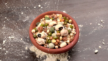 Mixed dry organic cereal and grain seed pile on wooden background. For healthy food ingredient or carbohydrate food type and agricultural product concept.