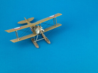Escort fighter scale miniature, copy space. WWI Model Biplane. Concept of hobby, scale model...