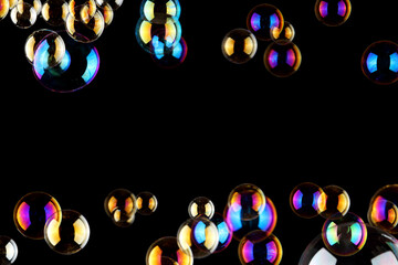 bubbles background / soap bubbles on black background with copy space for text or image , abstact background , celebration concept.