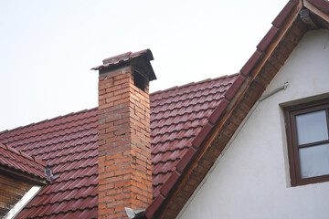 Obraz premium brick chimney at a house in the mountainous countryside. detail.