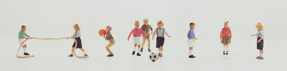 Horizontal banner with images of happy children in retro style clothes playing together, having fun isolated over grey background. Football, basketball, ropes
