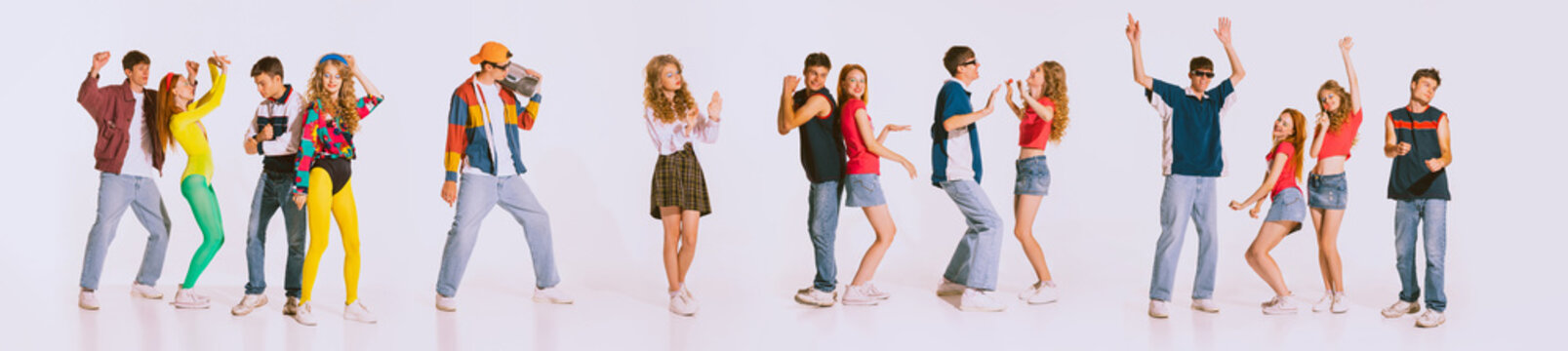 Group of young, cheerful people wearing 80s, 90s fashion style clothes dancing isolated over grey background. Disco party. Concept of youth, retro style, 90s era, fashion, lifestyle, ad