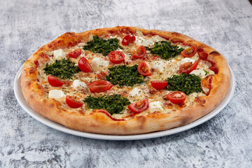 fresh pizza on the white plate