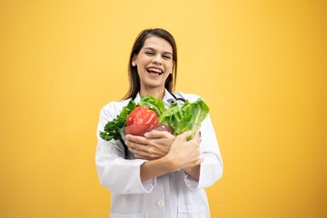 Portrait Caucasian American Positive dietitian with fruits and vegetables for healthy eating and diet. Healthy food, dietitian consultation. European  Nutritionist consultant health care Isolated.