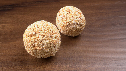Amarnath seed, Cholai or Rajgira laddo, Also in cube shape called chikki or cake form, Indian sweet and healthy food served in a plate and bowl. Selective focus.