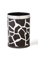 Close-up shot of a plastic cylinder trash can with a print textured leather finish and trimmed with metal. The waste basket is isolated on a white background. Front view.