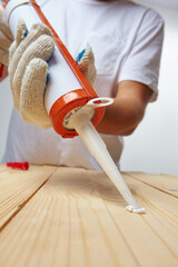 Men's hand uses silicone adhesive