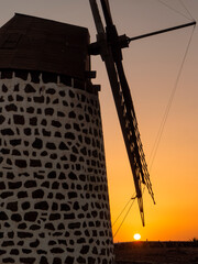 silhouette of a windmill at sunset, in Fuerteventura island (Spain)
