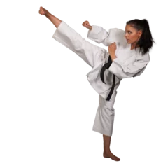 Fotobehang Woman in white  kimono kicks high in the air -  a karate  martial art girl isolated without background PNG © Samo Trebizan