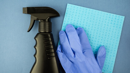 Detergent and cleaner for cleaning on a blue background.Cleaning and disinfection of premises.
