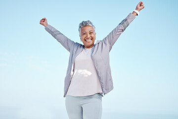 Excited senior woman with hands in air for exercise, fitness or workout portrait goals, success and...
