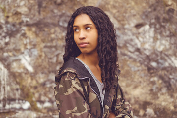 Naklejka premium Pretty mexican female young adult in camouflage clothing