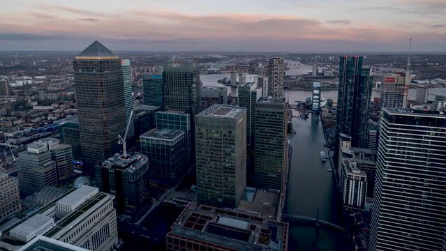 Day to night time lapse view of the skyscrapers at the financial district Canary Wharf in London, England