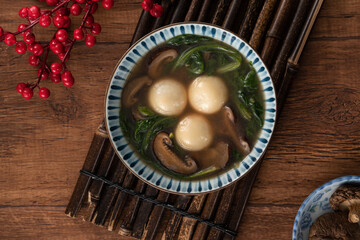 Eating big tangyuan yuanxiao with savory soup in Taiwan.