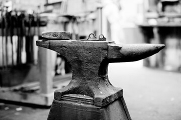 Two pitons sit on top of a well-used anvil in the Tin Shed at Patagonia headquarters in Ventura, California.