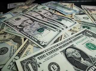 Banknotes of 5 US dollars, Stacks of money from a banknote of 5 dollars, top view.
five dollar bill Abraham Lincoln