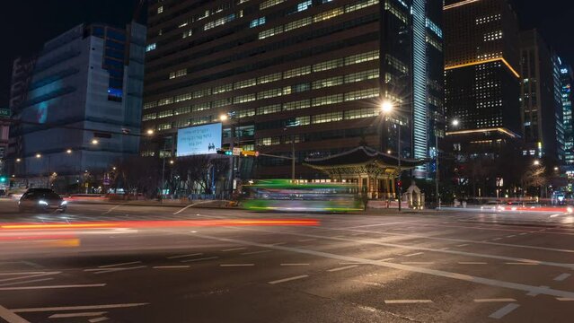 Night Seoul City Night Traffic Rush Hyperlapse at Gwanghwamun Station Crossroads - panning from left to right motion