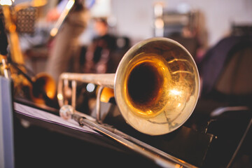 View of a golden trombone before the concert, view of a trombone player trombonist with musical...