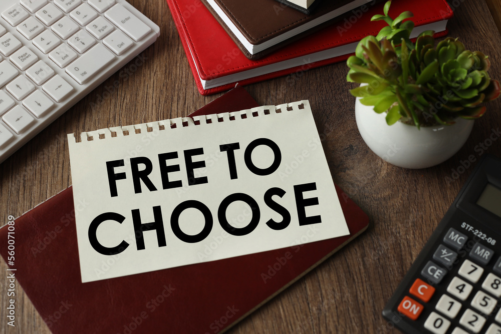 Poster free to choose on the work table text on a notepad near the white keyboard