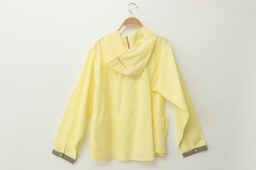 Minimal style.Yellow woman clothes is clothes hanger on white background.close up