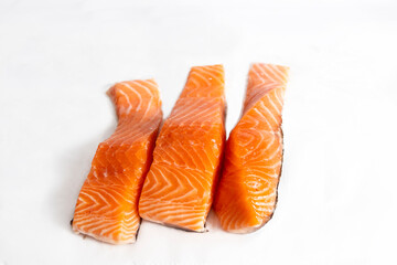 Fish, fresh salmon loins on white background in portrait