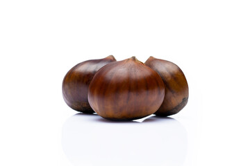 Raw roasted chestnuts on white background	
