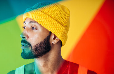 Image of an handsome young man posing on colored backgrounds wearing colorful trendy clothes....
