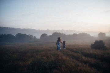 Fototapeta na wymiar two people walking in the fog
