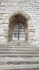 Fototapeta na wymiar Entrance door to old stone building