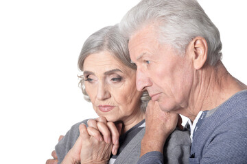 Portrait of sad old nice couple isolated on white background