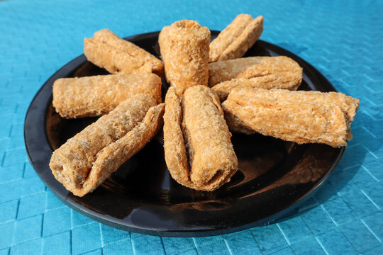 Popular indian winter sweets Gajak or Gachak made of jaggery, sesame seeds eater during Makar sankranti, uttarayan festivals