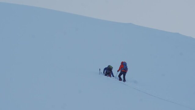 Mountaineers on the top of a snowy mountain