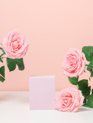 Beautiful podium with pink roses on pink background for product, gift and cosmetic presentation....