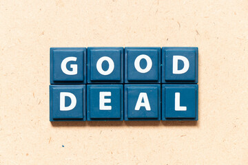 Tile letter in english word good deal on wood background