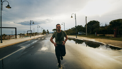 Athlete Running In The Rain