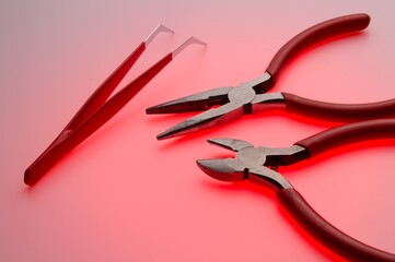 Tool for working with electricians wire cutters and pliers. Full color background. Close-up.
