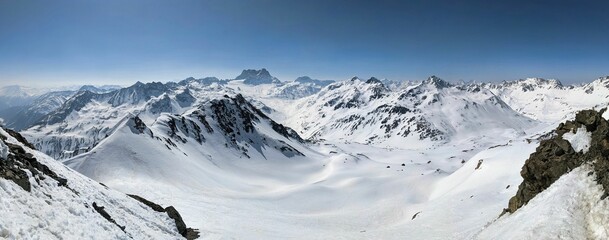 Ski tour in the beautiful Swiss Alps in Davos Klosters Mountains. Ski mountaineering. View to Piz Kesch. on Sertigpass