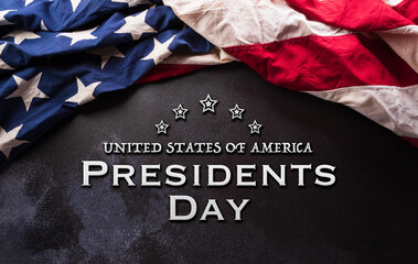 Fototapeta na wymiar Happy Presidents day concept made from American flag and the text on dark stone background.
