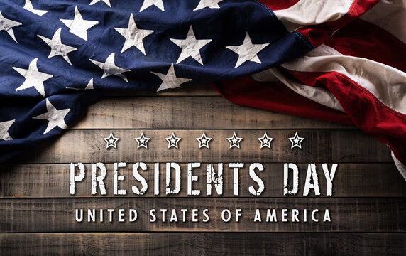 Happy Presidents day concept made from American flag and the text on dark wooden background.