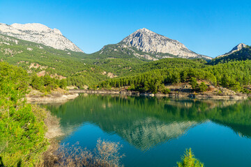 Naklejka na ściany i meble Scenic view of Doyran lake with reflection of mountains 