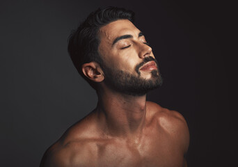 Skincare, face and man with beauty, dermatology and detox for wellness, luxury and cosmetics on studio background. Male, guy or natural body care for grooming, treatment or routine for organic facial
