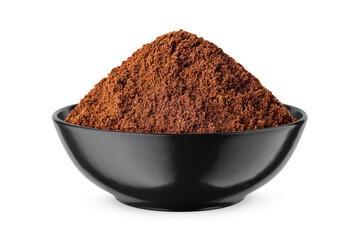 Ground coffee in round black bowl isolated on white. Front view.