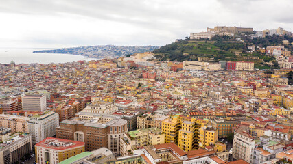 Fototapeta premium Aerial view of the Charterhouse of St. Martin, a former monastery complex, now a national museum, and Sant' Elmo castle. They are located on Vomero hill, that commands the city of Naples in Italy.