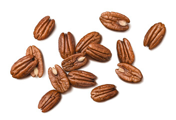 Shelled pecans isolated on white background. Nuts scattered. Diagonal composition