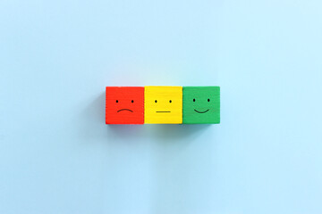 Top view image of cubes with happy and sad face. concept of happiness emotion and satisfaction