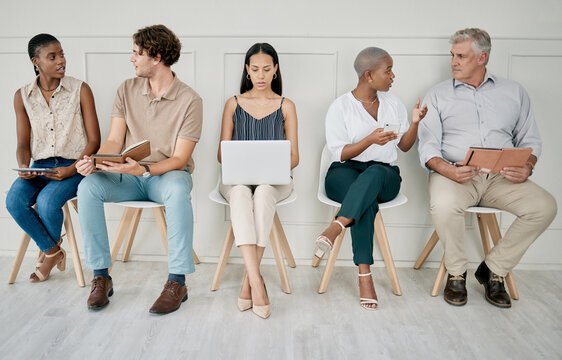 Hiring, recruitment or people in a waiting room for a marketing job interview at a office building. Human resources, men and business women with career goals wait as a group for company hr manager